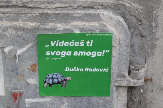 green and white wall mounted signage